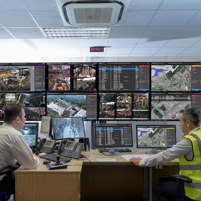 two men using Genetec unified video surveillance system to monitor company perimeter