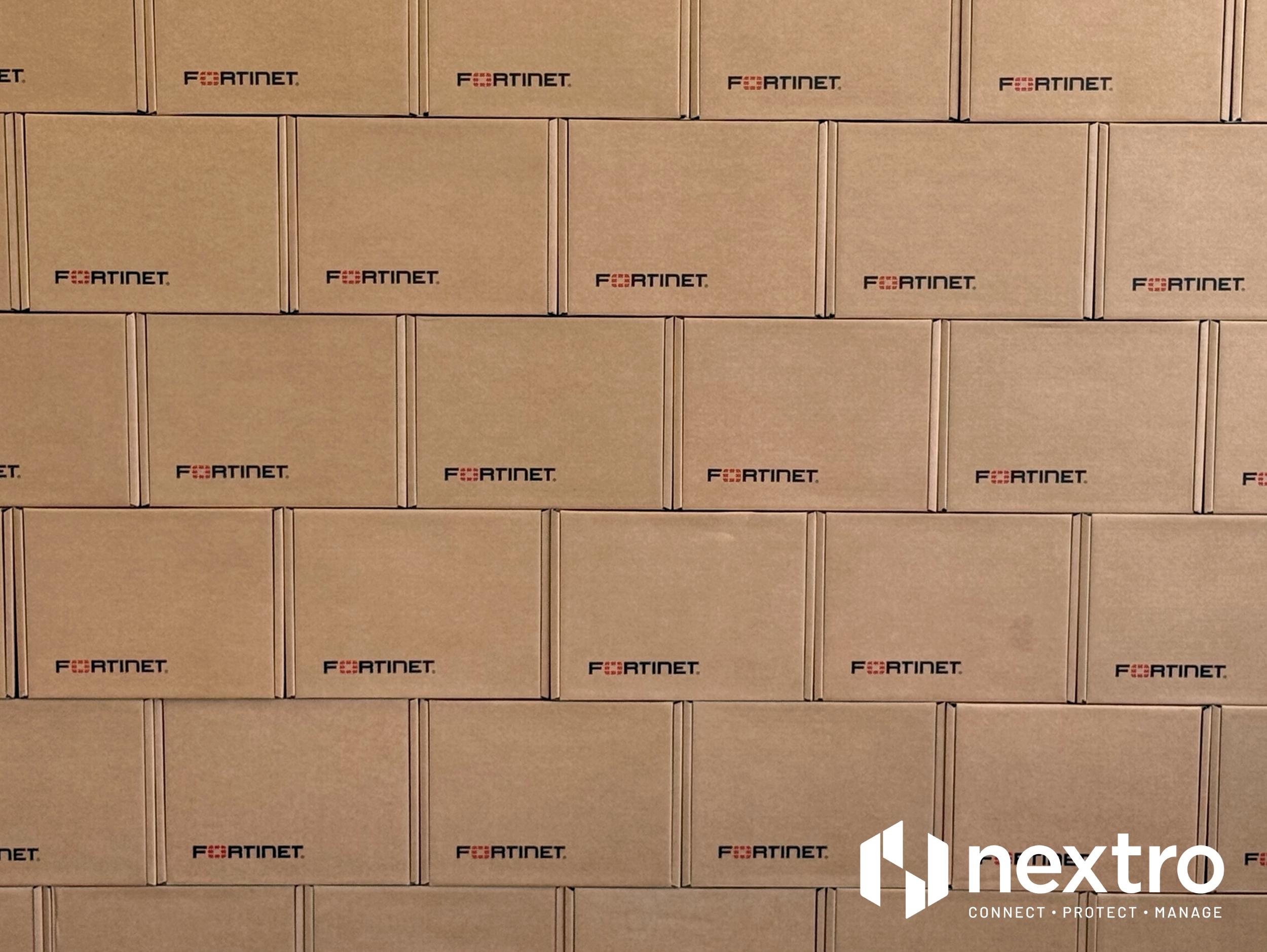 A wall of Fortinet firewall boxes from one of Nextro’s recent 40+ site SD-WAN deployments.